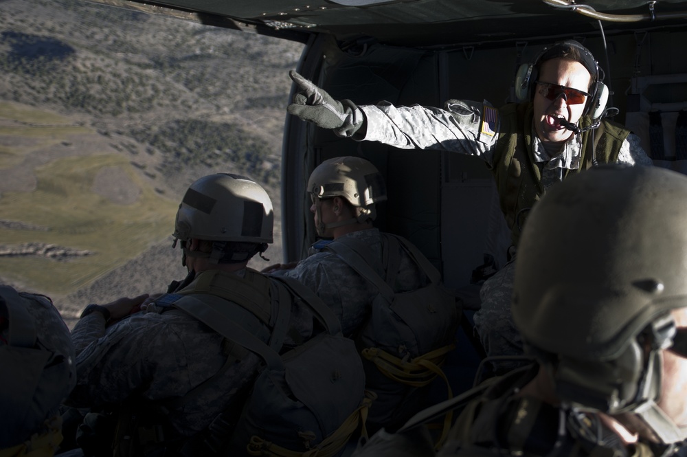 Utah Army National Guard performing static line jumps from Black Hawks