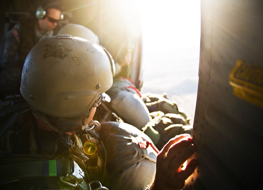 Utah Army National Guard performing static line jumps from Black Hawks