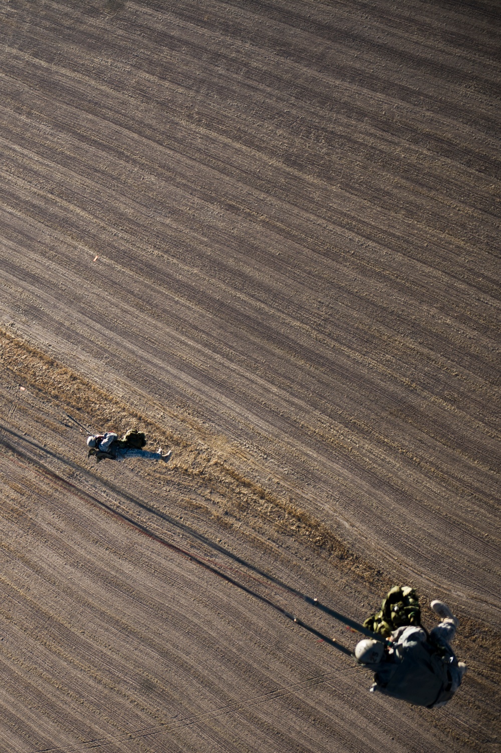 Utah Army National Guard performing static line jumps from Black Hawks