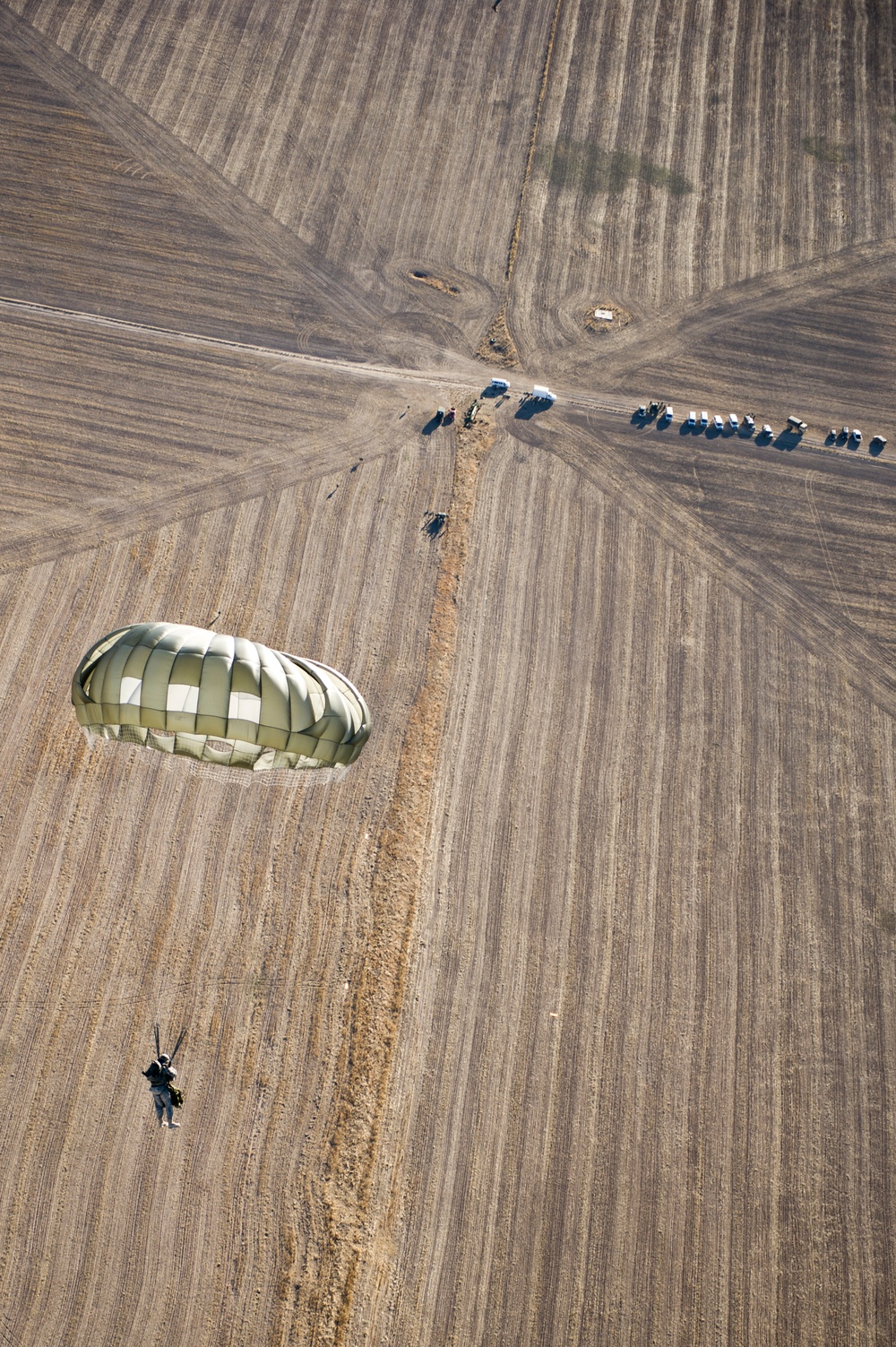 Utah Army National Guard performing static line jumps from Black Hawks