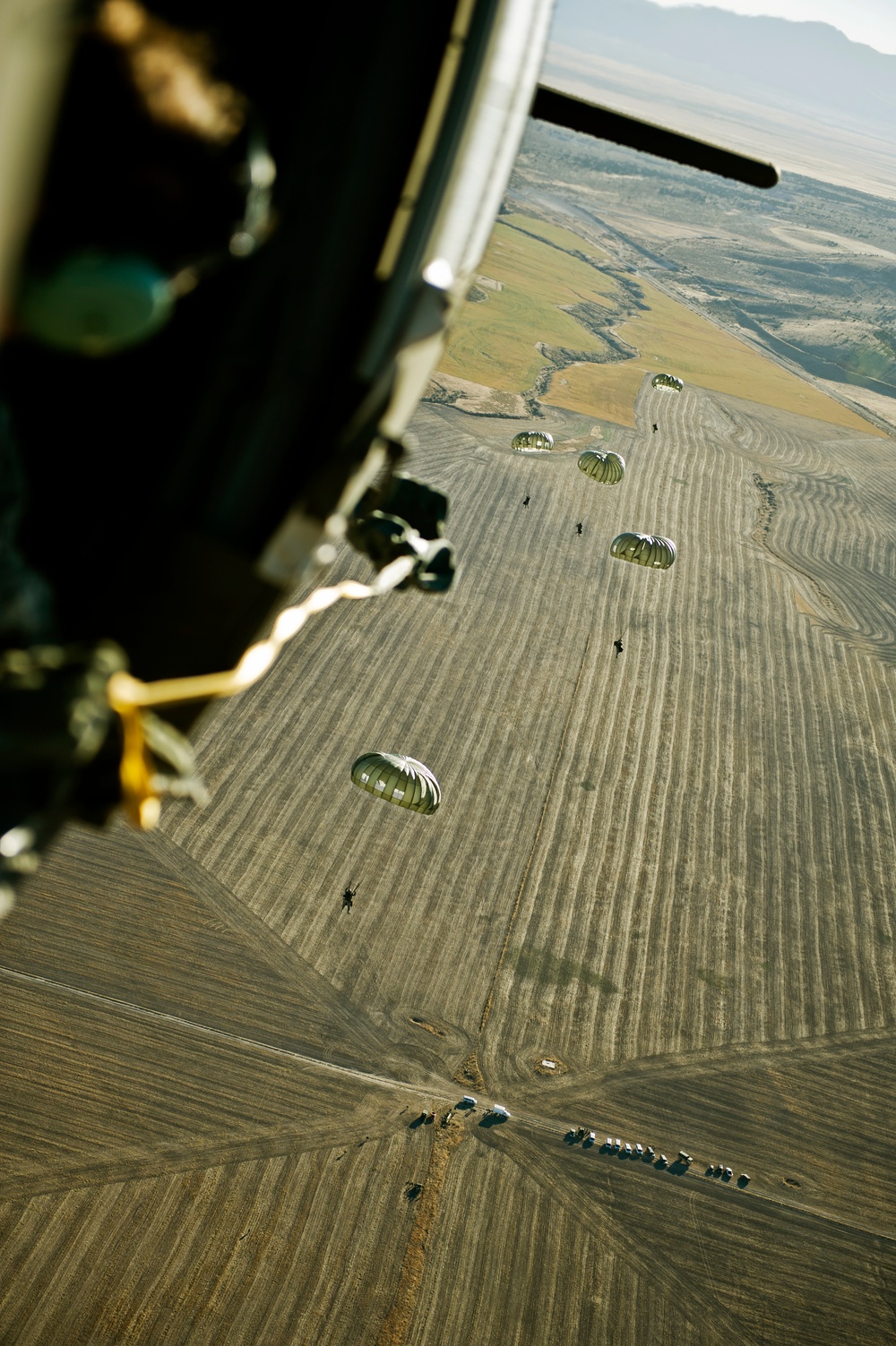 Utah Army National Guard performing static line jumps from Black Hawks