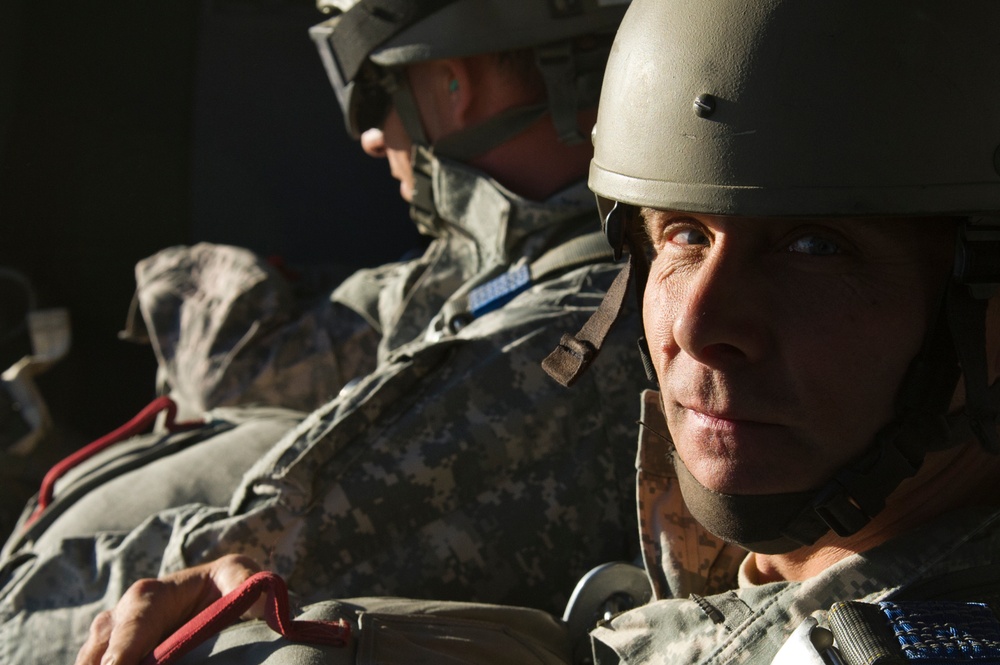 Utah Army National Guard performing static line jumps from Black Hawks