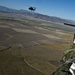 Utah Army National Guard performing static line jumps from Black Hawks