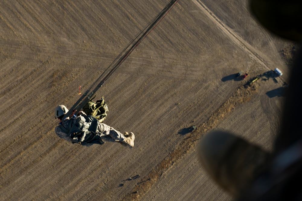 Utah Army National Guard performing static line jumps from Black Hawks