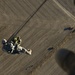 Utah Army National Guard performing static line jumps from Black Hawks