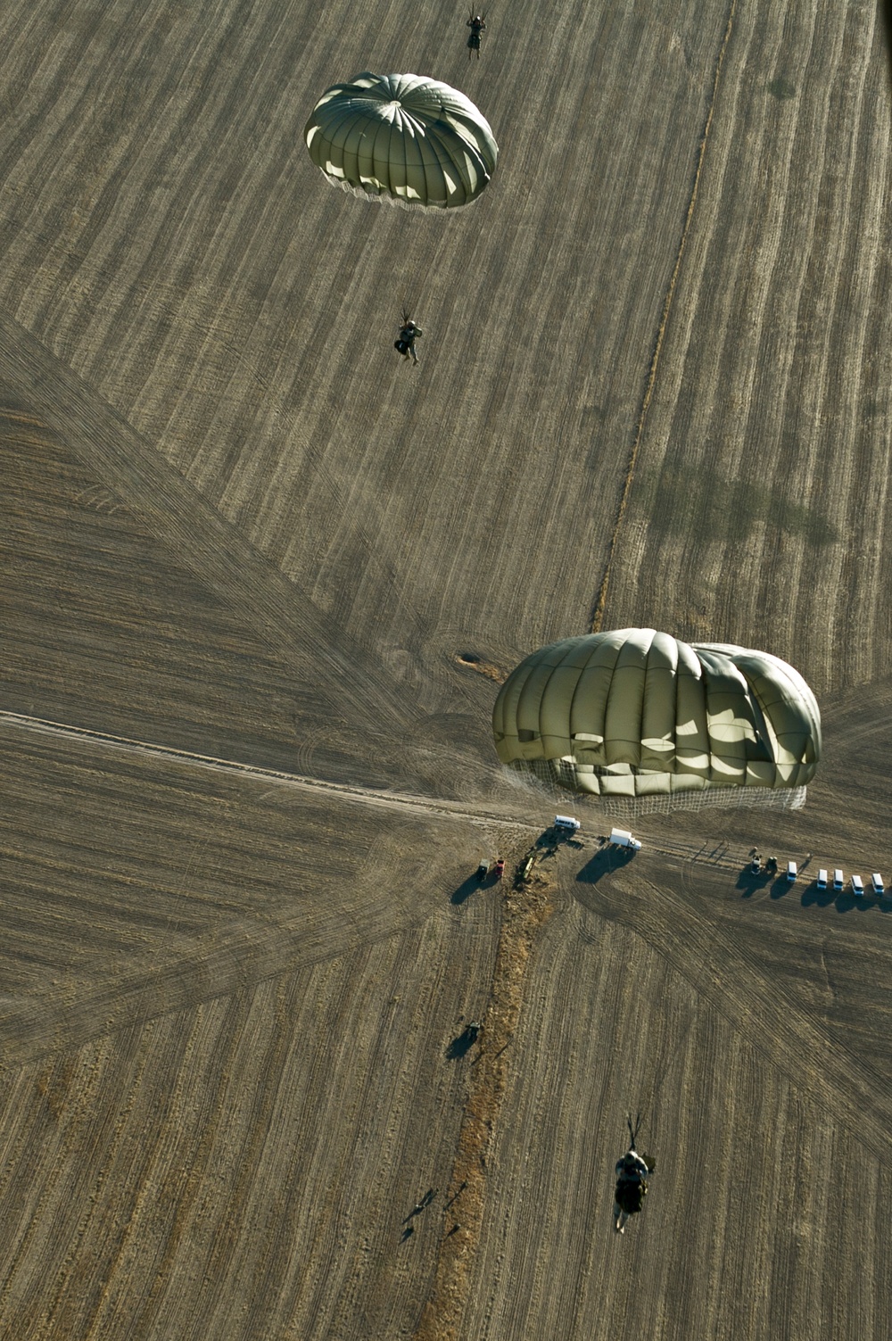 Utah Army National Guard performing static line jumps from Black Hawks