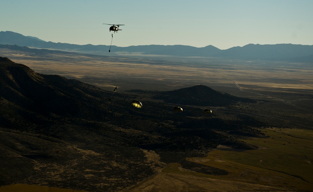 Utah Army National Guard performing static line jumps from Black Hawks