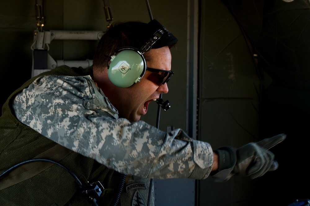 Utah Army National Guard performing static line jumps from Black Hawks