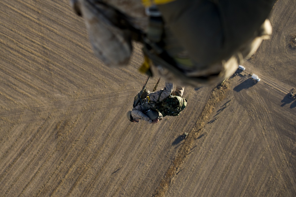 Utah Army National Guard performing static line jumps from Black Hawks