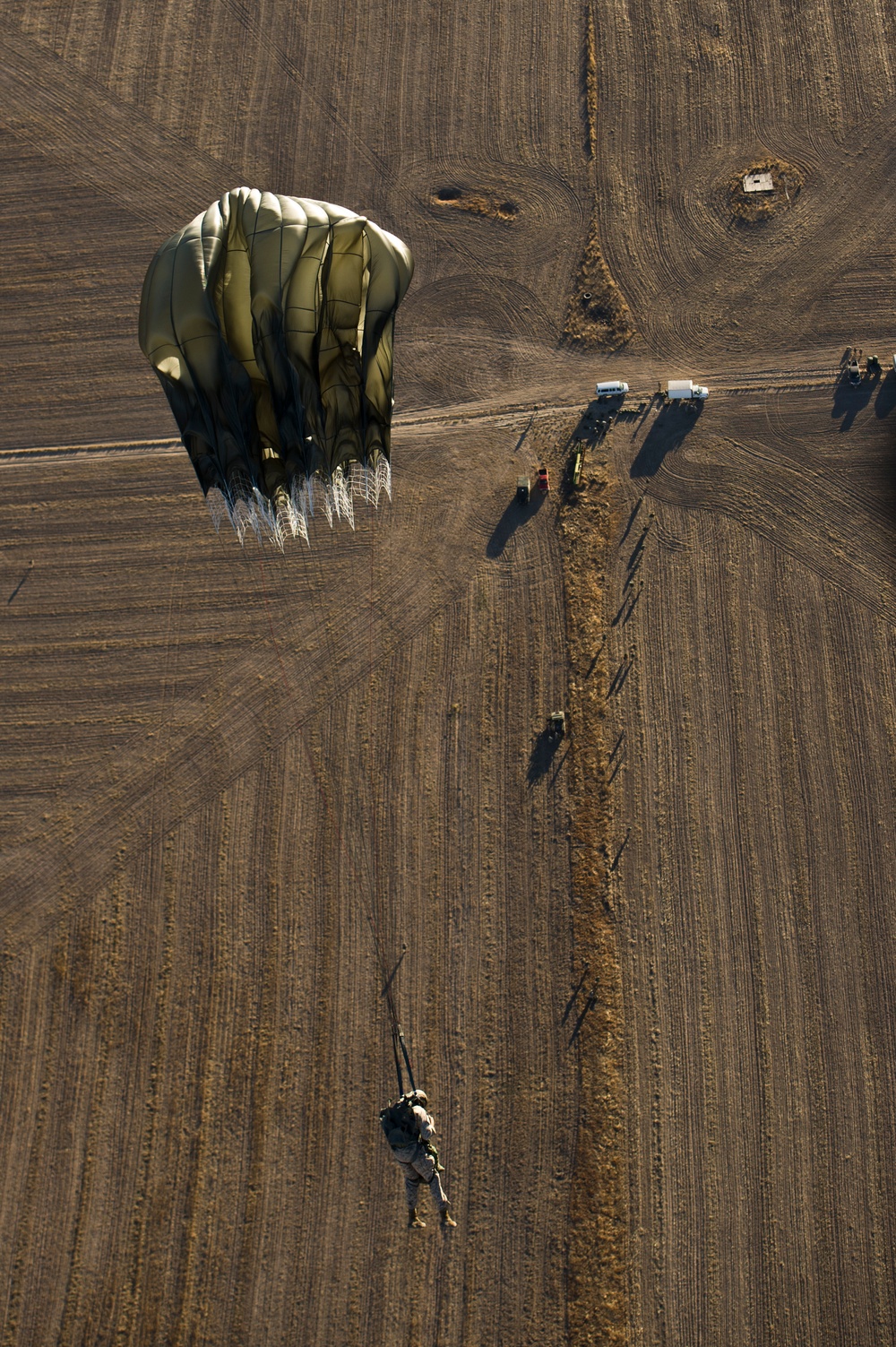 Utah Army National Guard performing static line jumps from Black Hawks