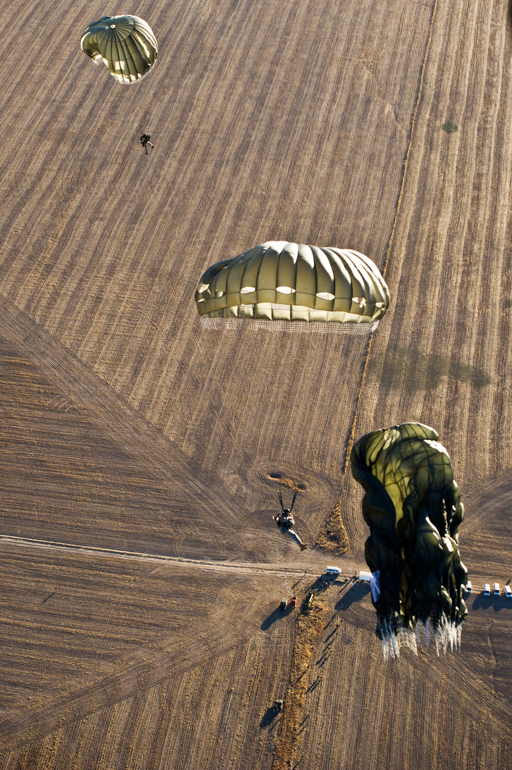 Utah Army National Guard performing static line jumps from Black Hawks