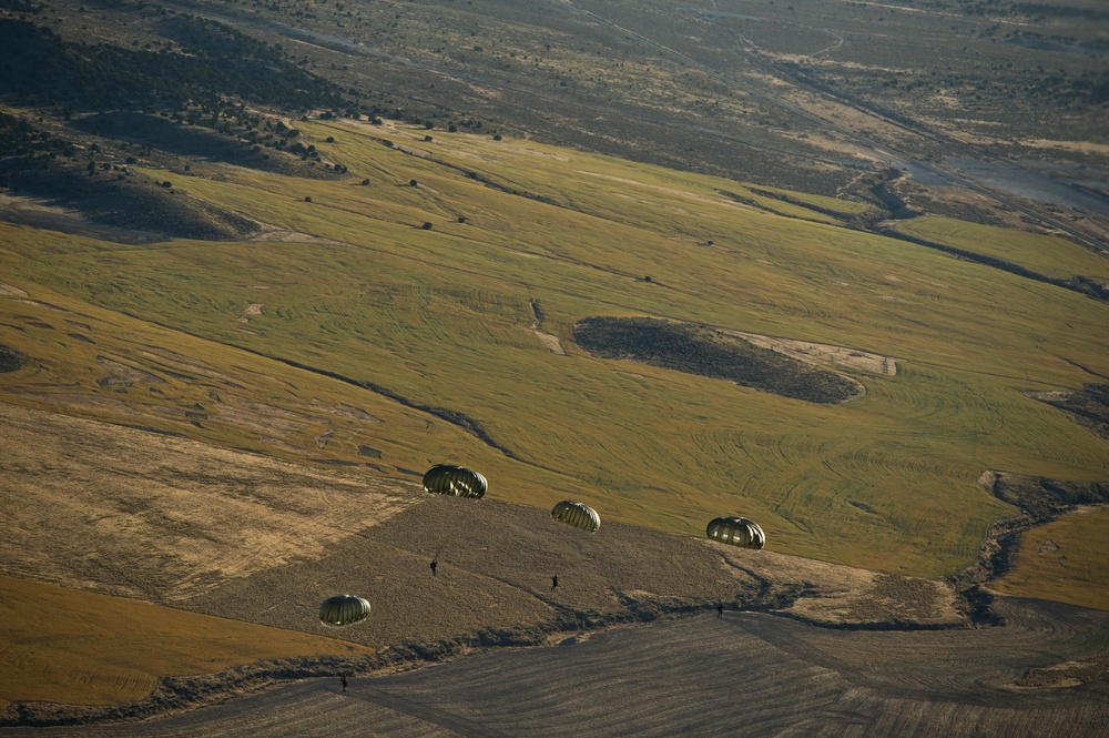 Utah Army National Guard performing static line jumps from Black Hawks