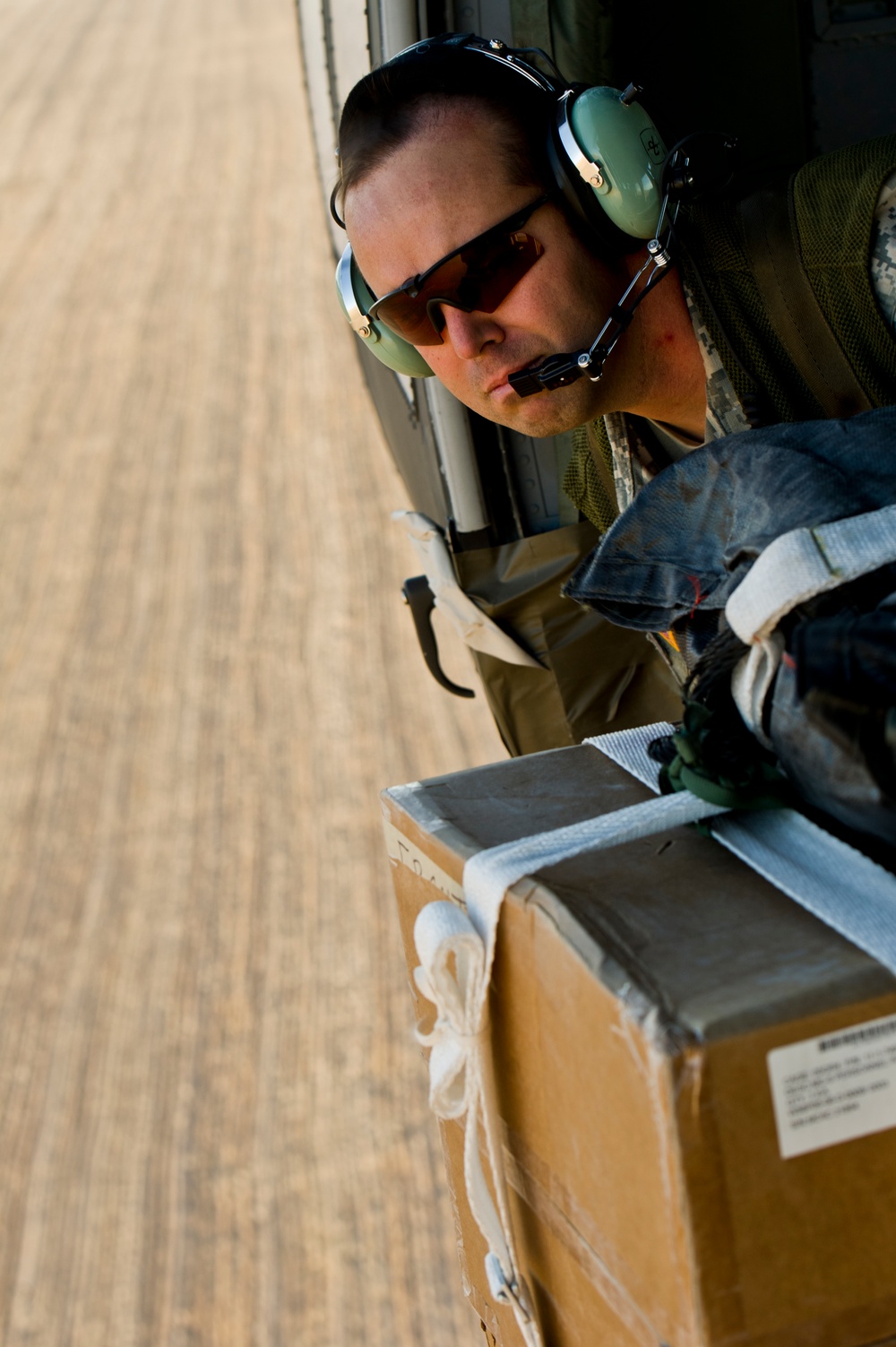 Utah Army National Guard performing static line jumps from Black Hawks