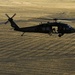 Utah Army National Guard performing static line jumps from Black Hawks