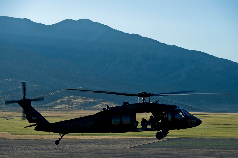 Utah Army National Guard performing static line jumps from Black Hawks