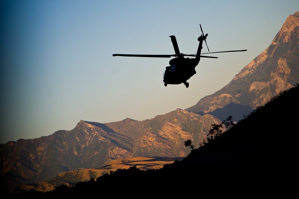 Utah Army National Guard performing static line jumps from Black Hawks