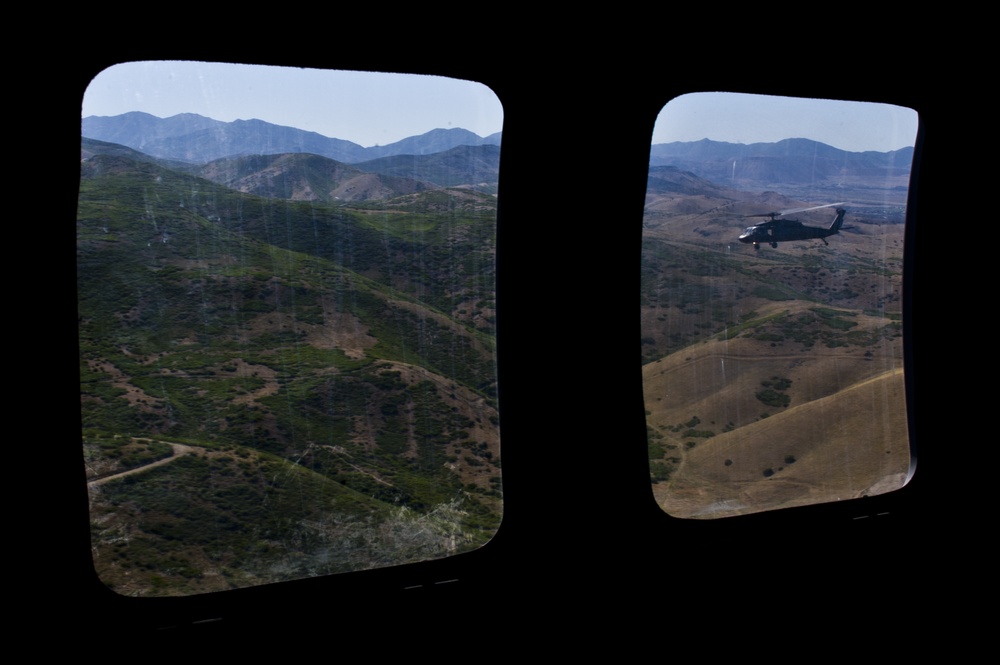 Utah Army National Guard performing static line jumps from Black Hawks