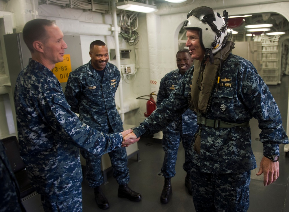 Commander of Expeditionary Strike Group 3, greets commander of Amphibious Squadron 5