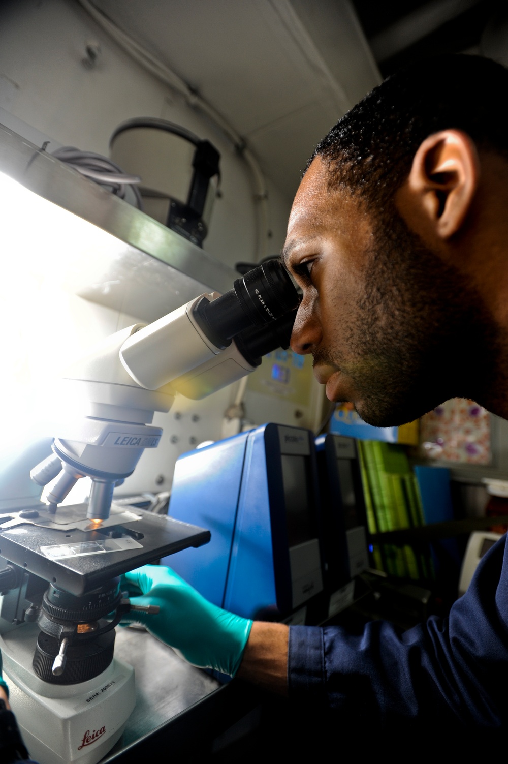 Sailor examines blood sample