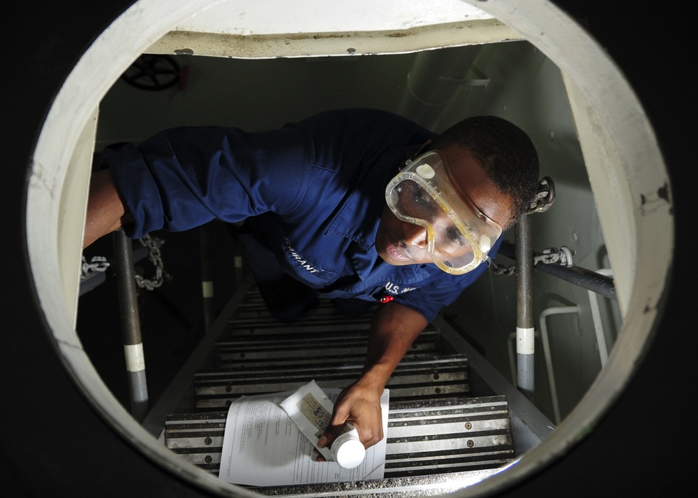 USS George H.W. Bush sailor performs maintenance