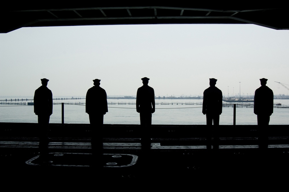 USS Dwight D. Eisenhower sailors man the rails