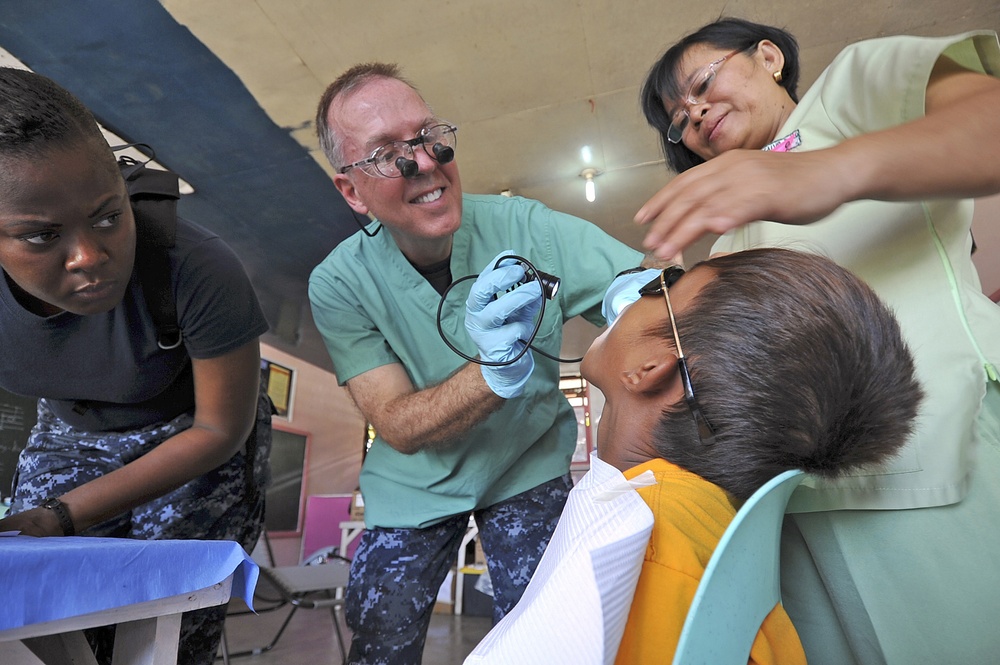 Patient exam during Pacific Partnership 2012