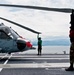 Sailors prep to stow MH-60S Sea Hawk's rotor blades