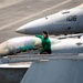 Sailors perform maintenance on F/A-18C Hornet