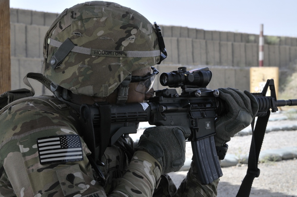 Spc. Glenn Houghton fires his weapon