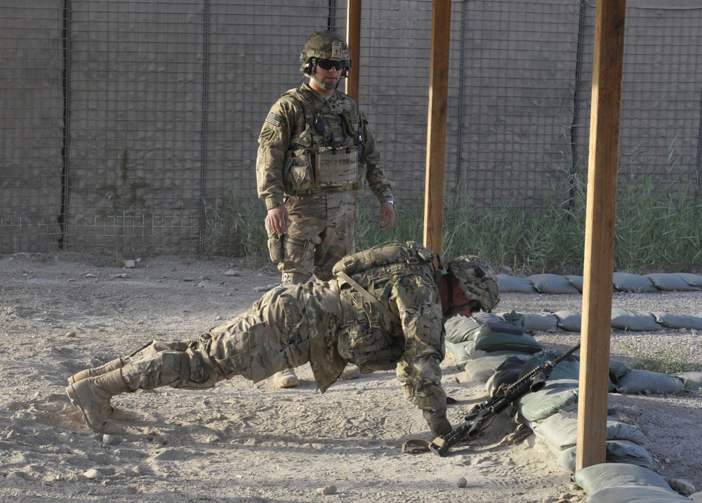 Spc. Timothy Duncan performs pushups