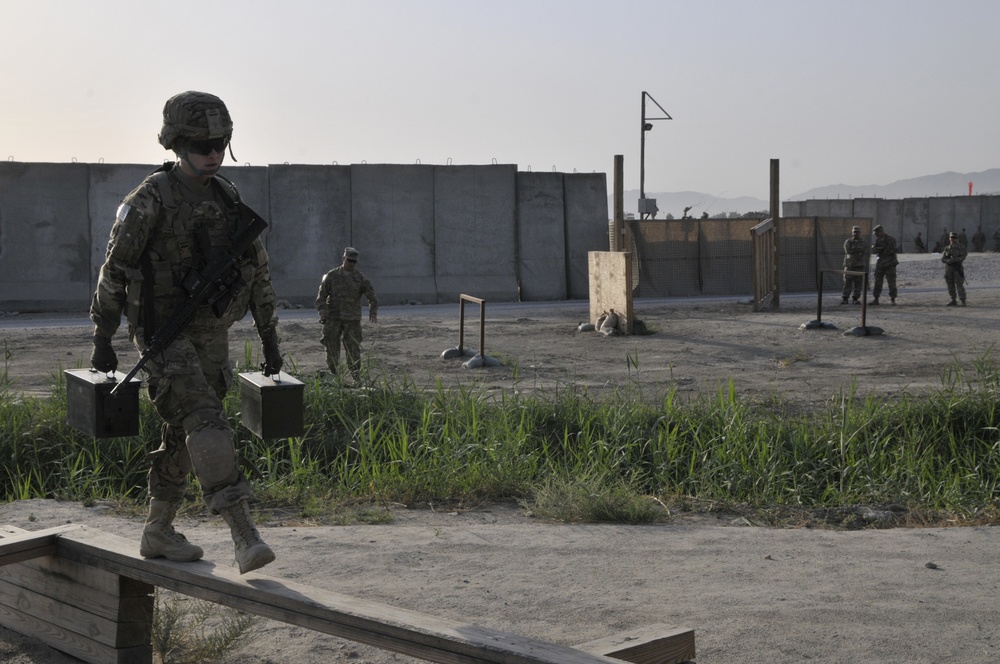 Sgt. Jennifer Alridge walks across the balance beam