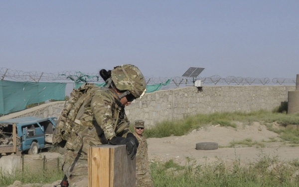 Sgt. Celina Foy climbs a wall