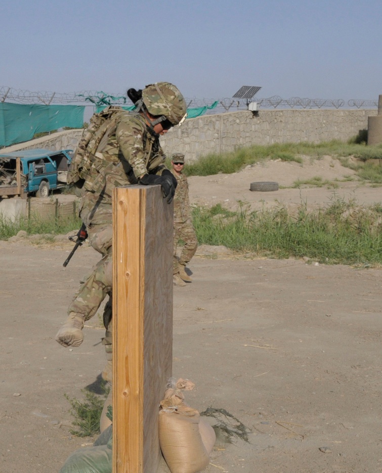 Sgt. Celina Foy climbs a wall