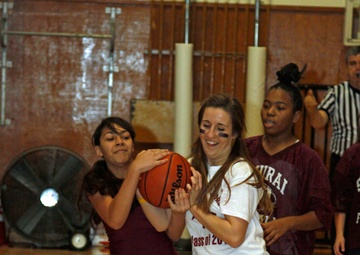 Teachers school students during annual basketball game