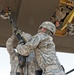 316th ESC soldiers attach the rope to a CH-47 CHinook