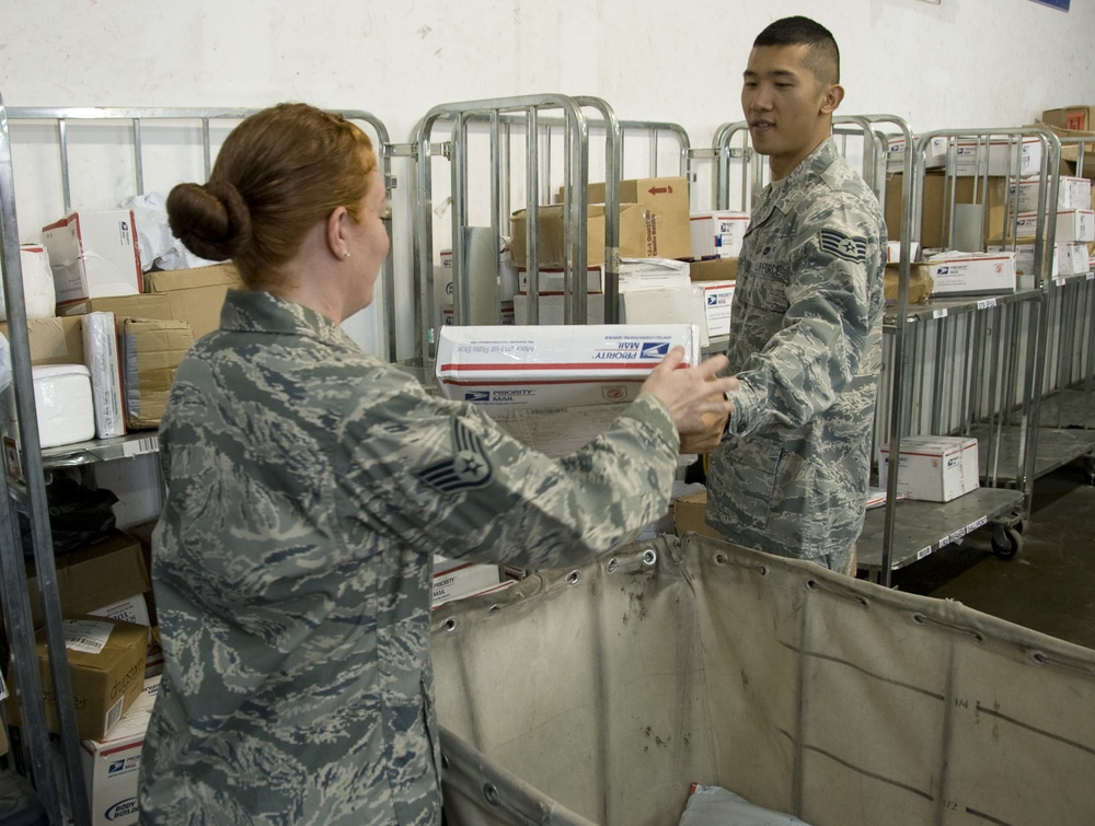 Airmen provide ‘customer service with a smile' one package at a time