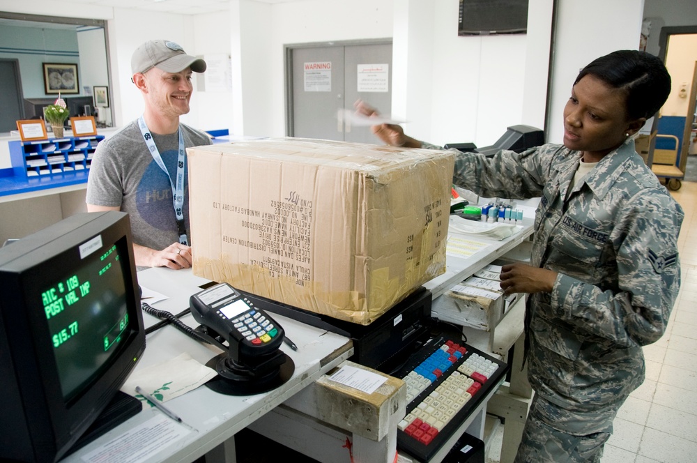 Airmen provide ‘customer service with a smile' one package at a time