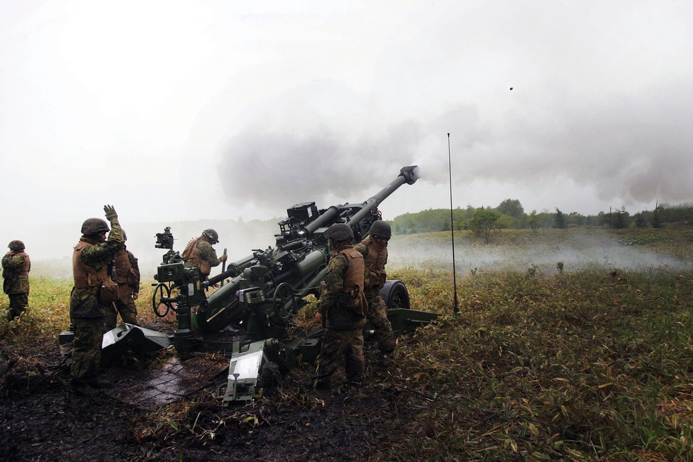 Marines send artillery rounds downrange