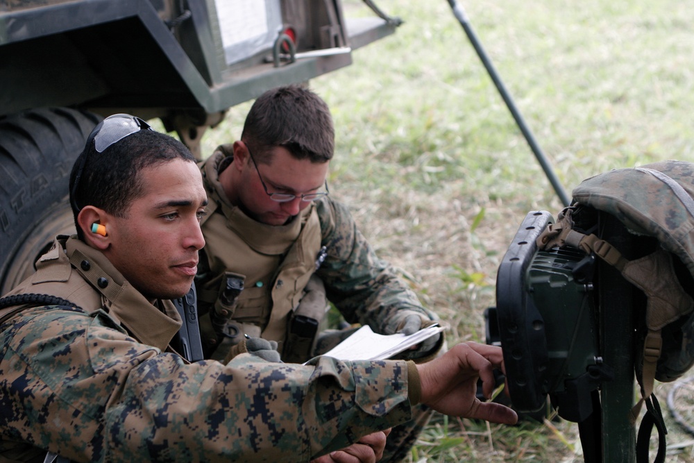 Marines send artillery rounds downrange