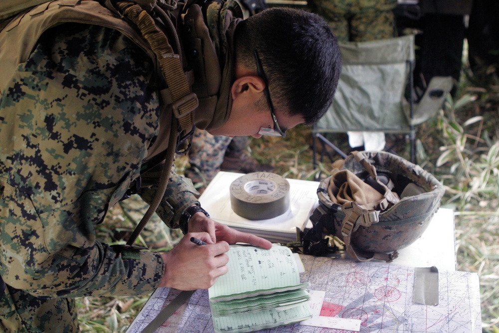 Marines send artillery rounds downrange