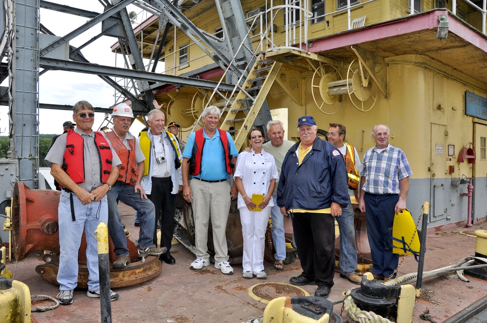 Crewmembers of the Dredge Thompson hand over control of the vessel to the Prairie du Chien representatives.