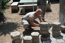 Missouri Guard engineers build stone courtyard at Honduran school