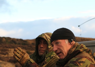 U.S. Marine and New Zealand gunners fire cannons in snowstorm to conclude Exercise Brimstone