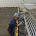 USS Iwo Jima sailor performs maintenance