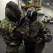Sailors put on gear for drill