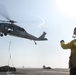 Sailor directs SH-60F Sea Hawk