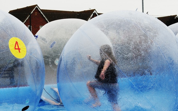 Children enjoy 'zorbing' at youth center