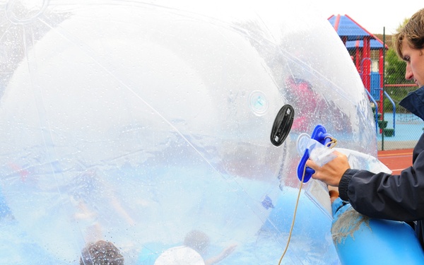Children enjoy 'zorbing' at youth center