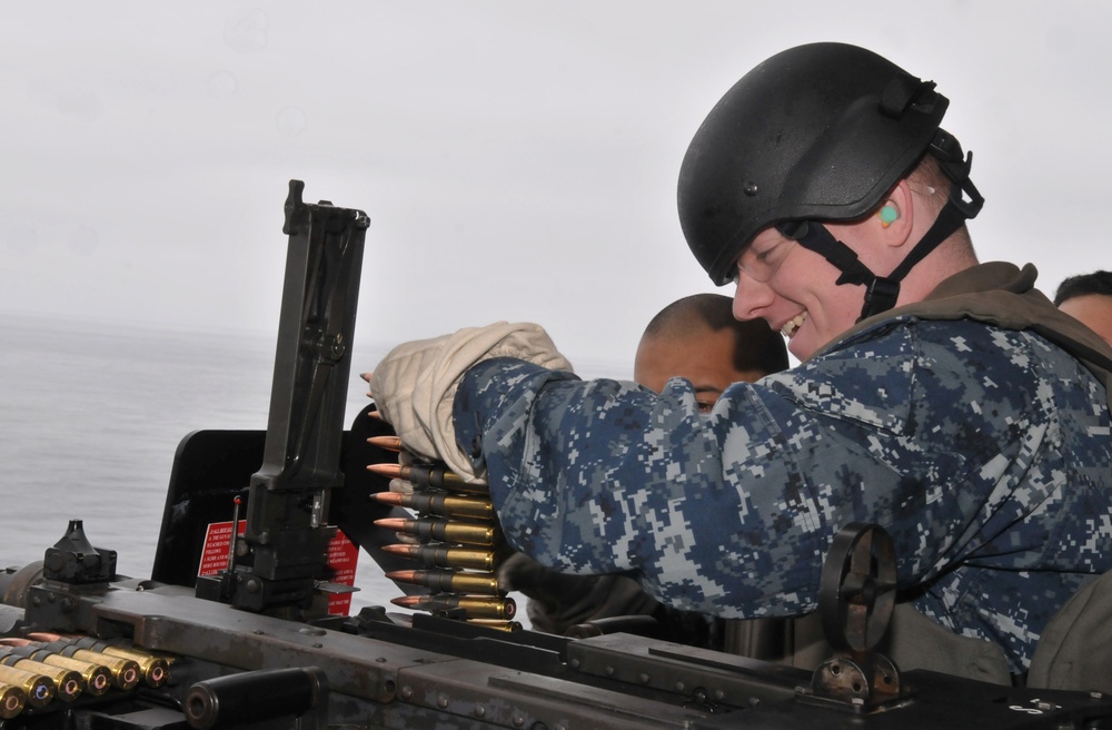 Midshipmen fire .50-caliber machine gun