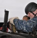 Midshipmen fire .50-caliber machine gun